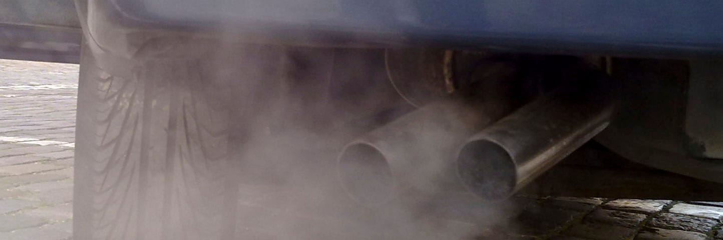 IMAGE: A car’s tailpipe emitting toxic smoke and fumes
