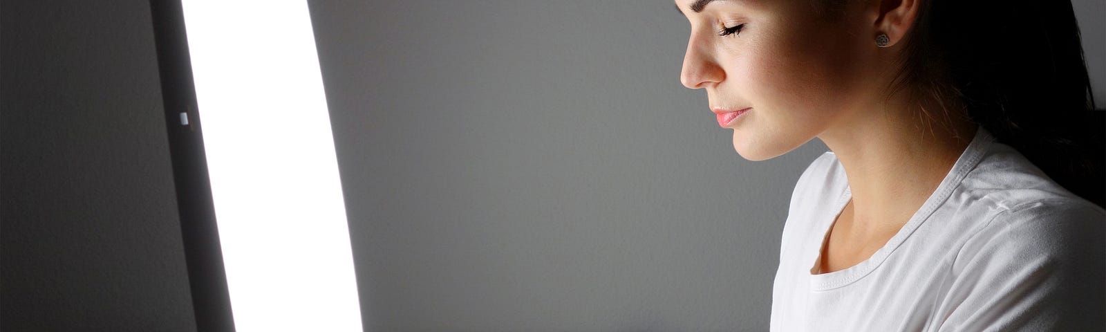 Young woman administering a light therapy