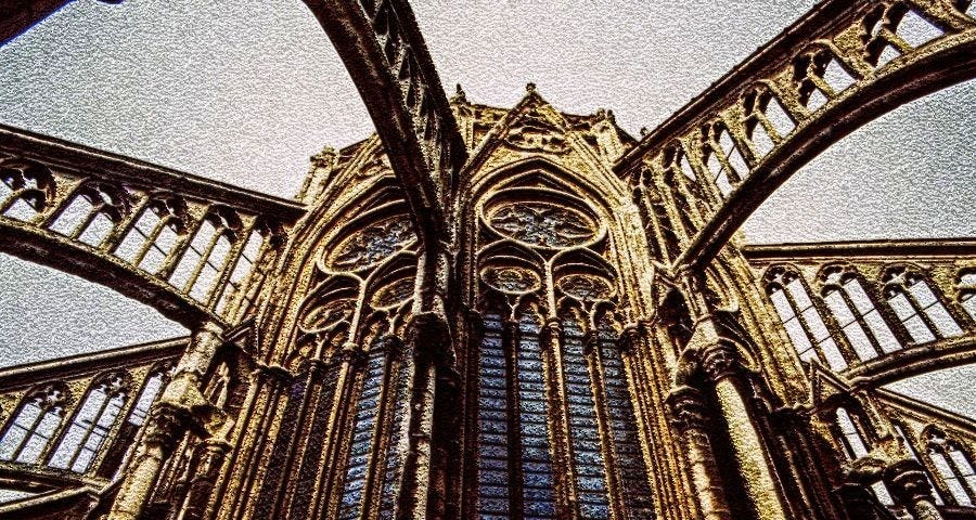 A photo of fyling buttresses on a medieval cathedral. Flying buttresses are used in the story as a demonstration of how structural changes can support scaled growth.