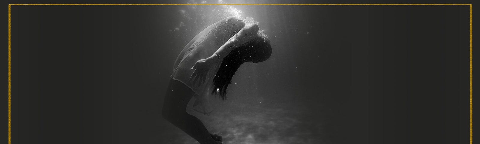 Woman floating underwater