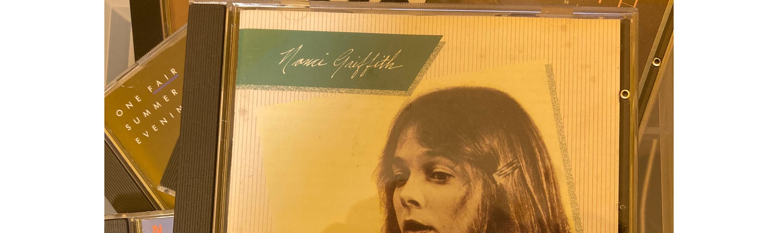 Author’s photo of the covers of their copies of the Nanci Griffith CD albums features in the article