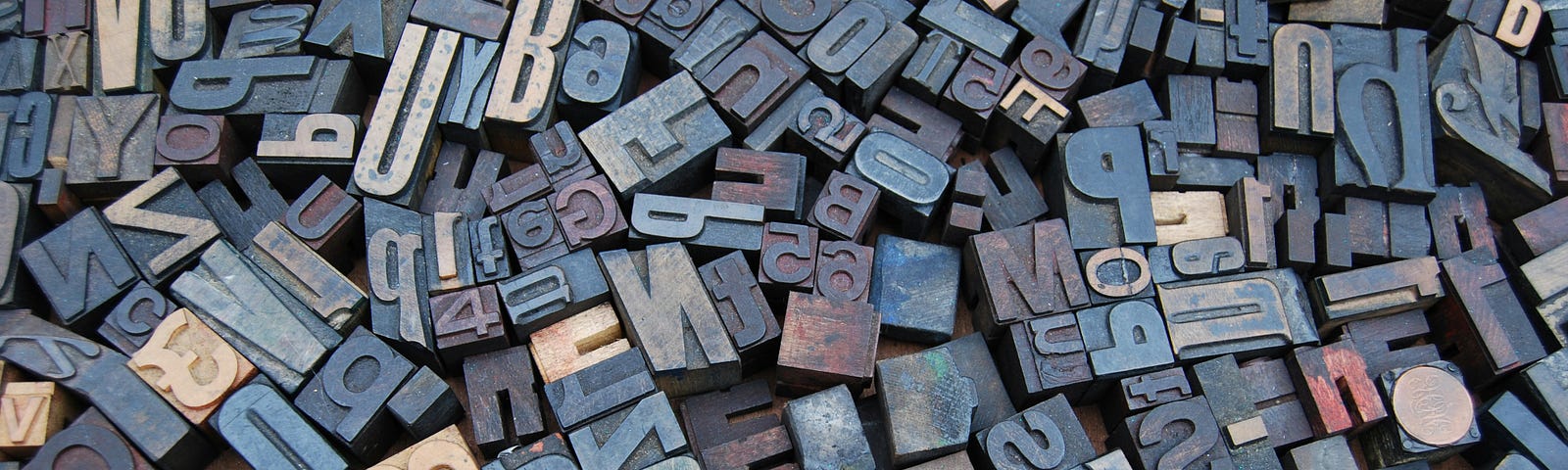 A bunch of vintage woodcut letters for letterpress printing.