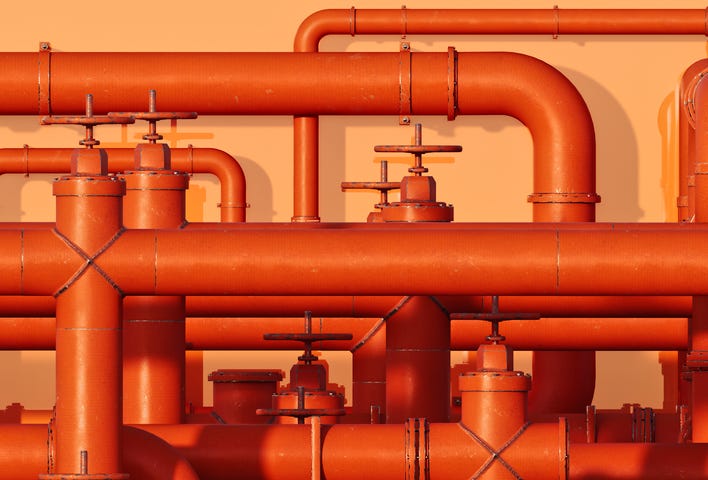 Image of many orange interconnected pipes