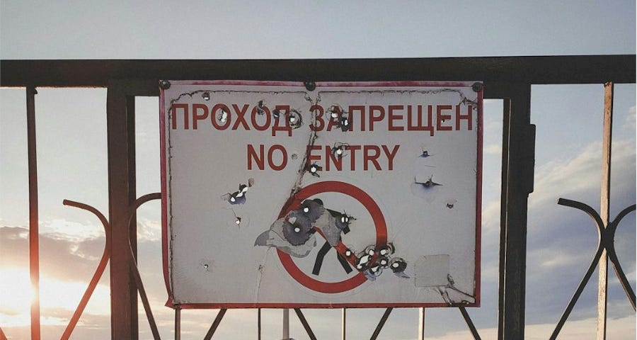 No Entry sign on a wrought iron gate