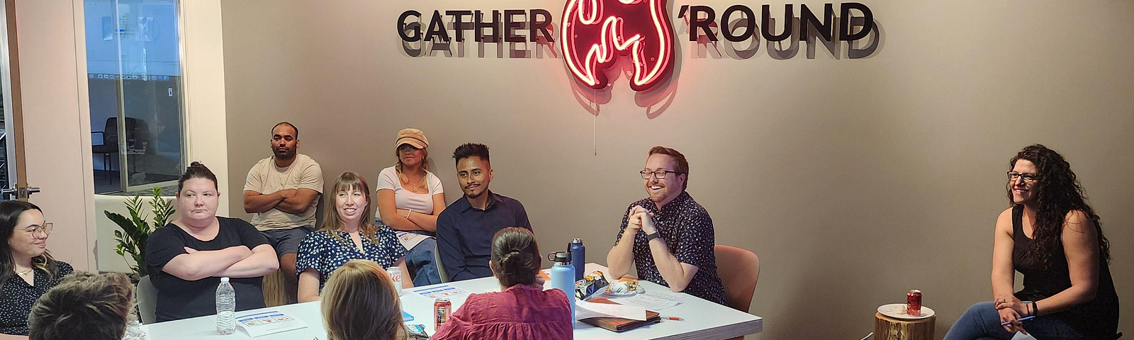 A team sitting around a conference room table, having a discussion. I’m sitting at the head of the table facilitating the group discussion.