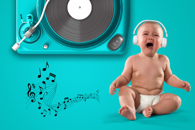 Baby wearing headphones crying to music.