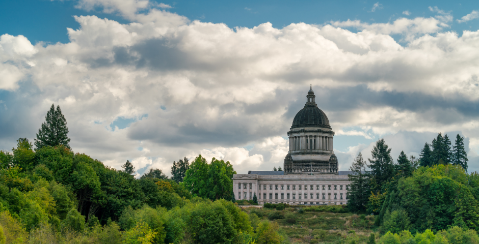 An image of the Washington State Capitol Building and Temple of Justice with Capital Lake in the foreground.