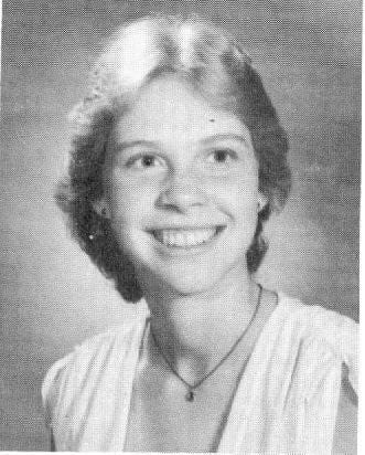 This is a small black-and-white photo of the author when she was a senior in high school.