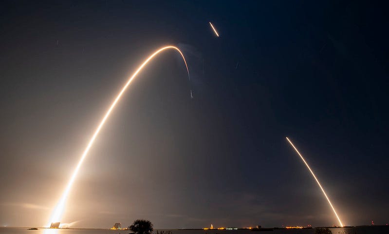 IMAGE: A long exposure photo shows the path of SpaceX’s Falcon 9 rocket as it launched the Ispace mission on Dec. 11, 2022, with the rocket booster’s return and landing visible as well