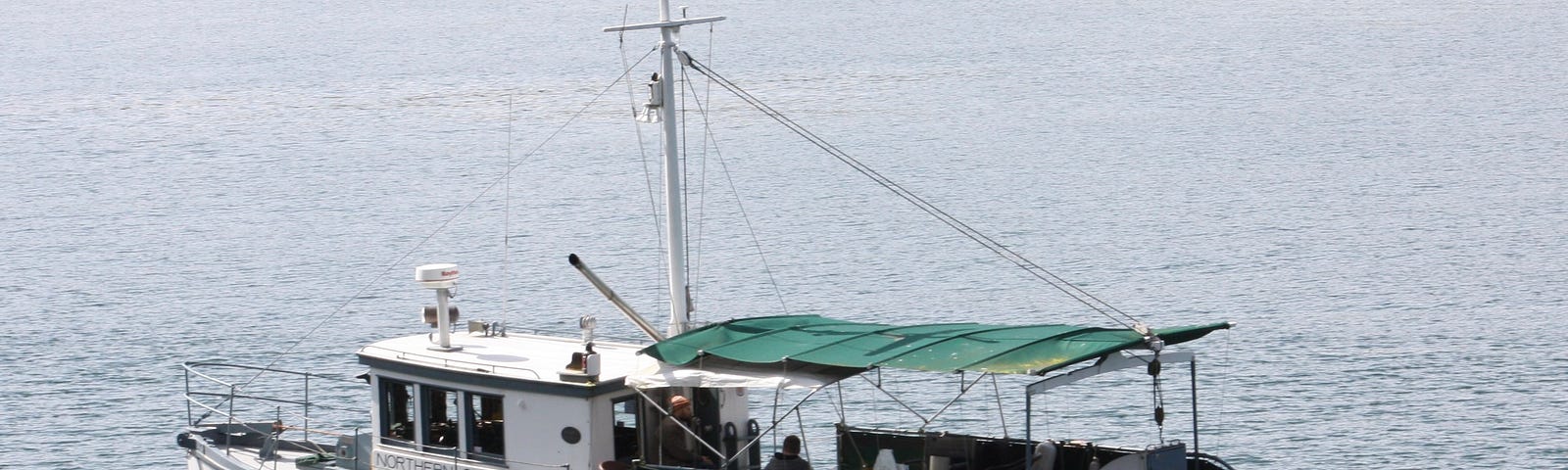 a photo of a 50 ft wooden power boat