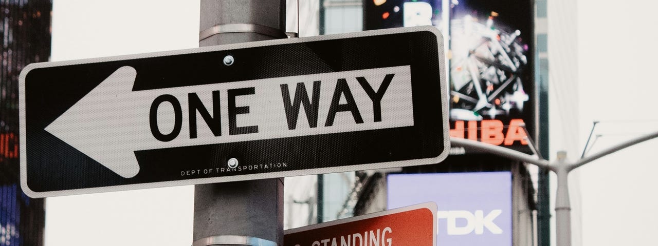 A “One Way” street sign