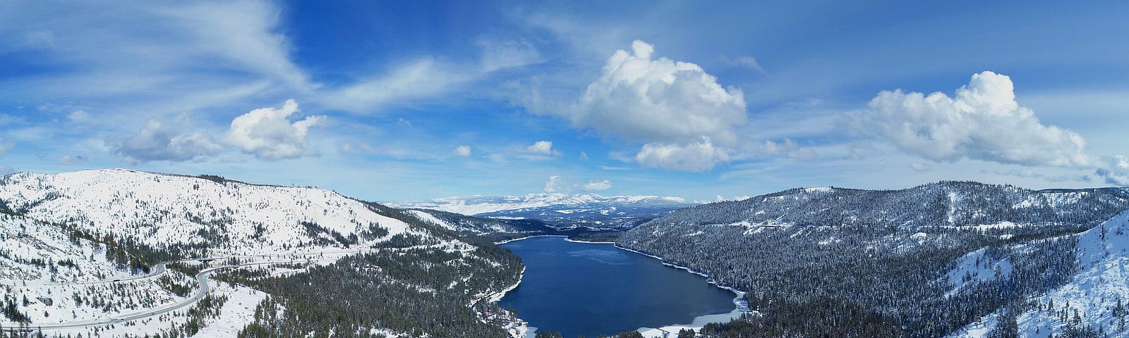 Donner Lake seen from Donner Summit, Highway 80 on the left and rail line in the valley.