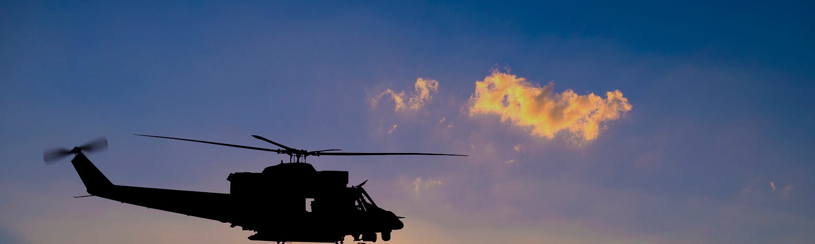 Rotorcraft at sunset.