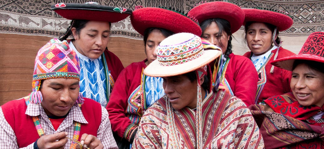 Quechuan weavers share their weaving insights at a Peru Weavers Awards held at the Centre for Traditional Textiles Away in Chinchero, Peru. (© April Orcutt. All Rights Reserved)