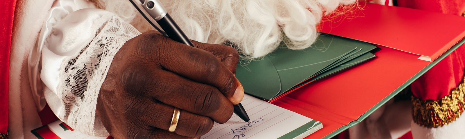 Picture of Santa Claus writing letters to people. From Pexels