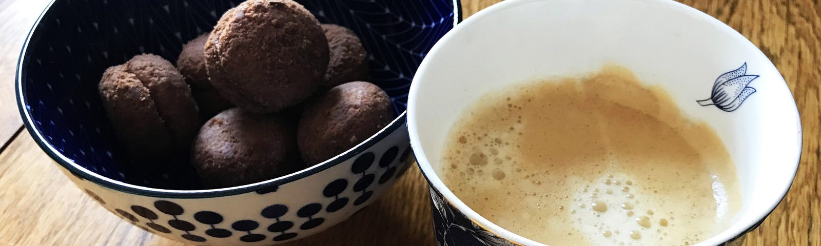 A cup of coffee and some Italian biscuits