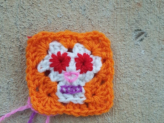 A free crochet pattern for a Day of the Dead granny square