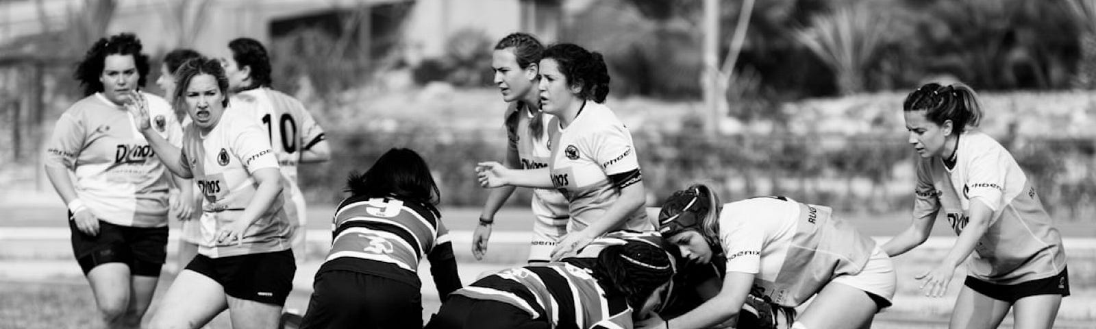 Black and white photo of women playing sport