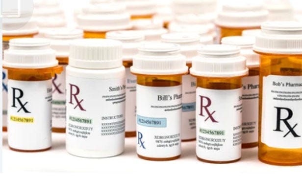 Rows of prescription pill bottles