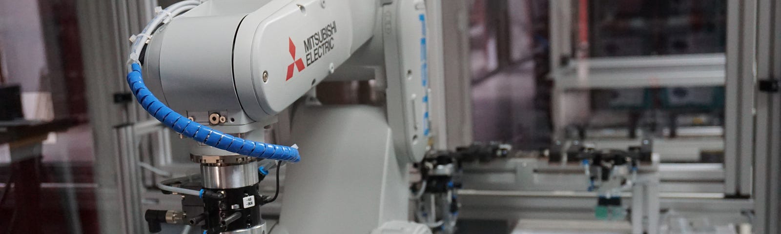 A robotic hand by Mitsubishi Electric is performing autonomous work.