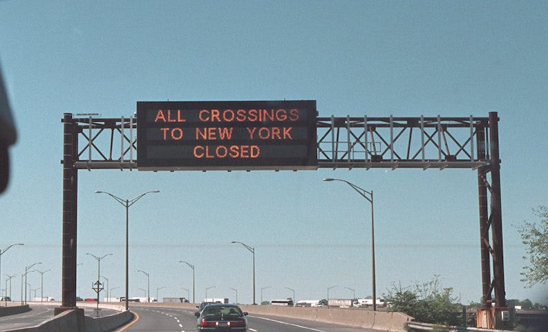 Highway sign on 9/11/21 saying “All Crossings to New York Closed”