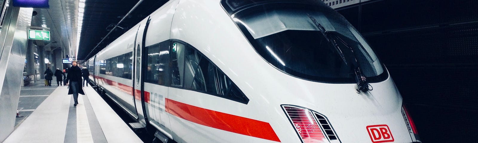 A sleek train stopped at an underground train station in Berlin, Germany.