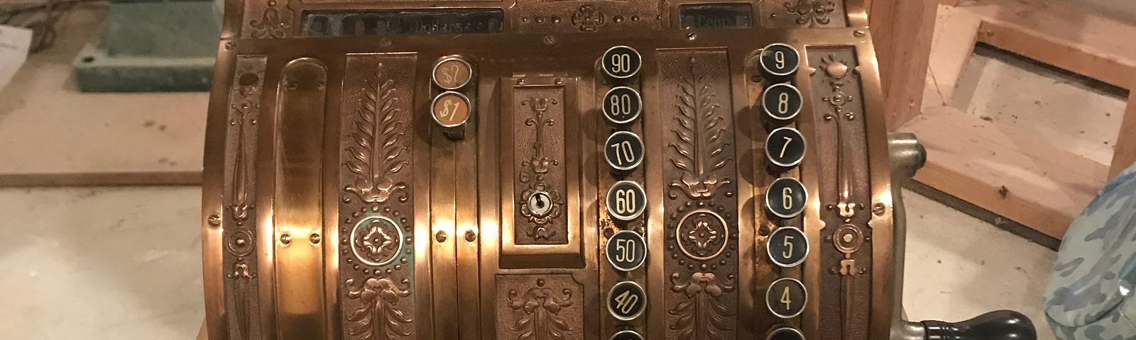 Front-facing view of antique cash register.