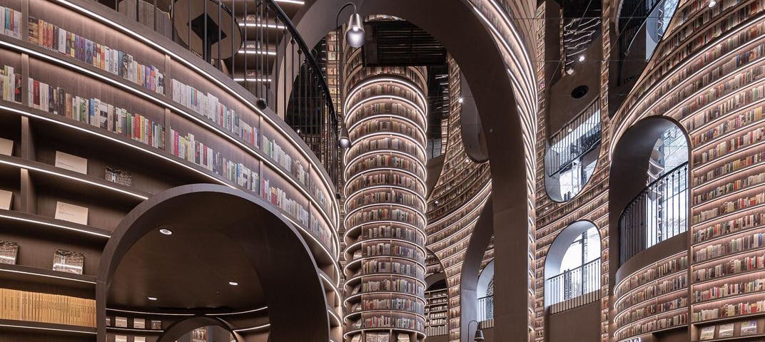 Immense, surreal bookstore with curved walls.