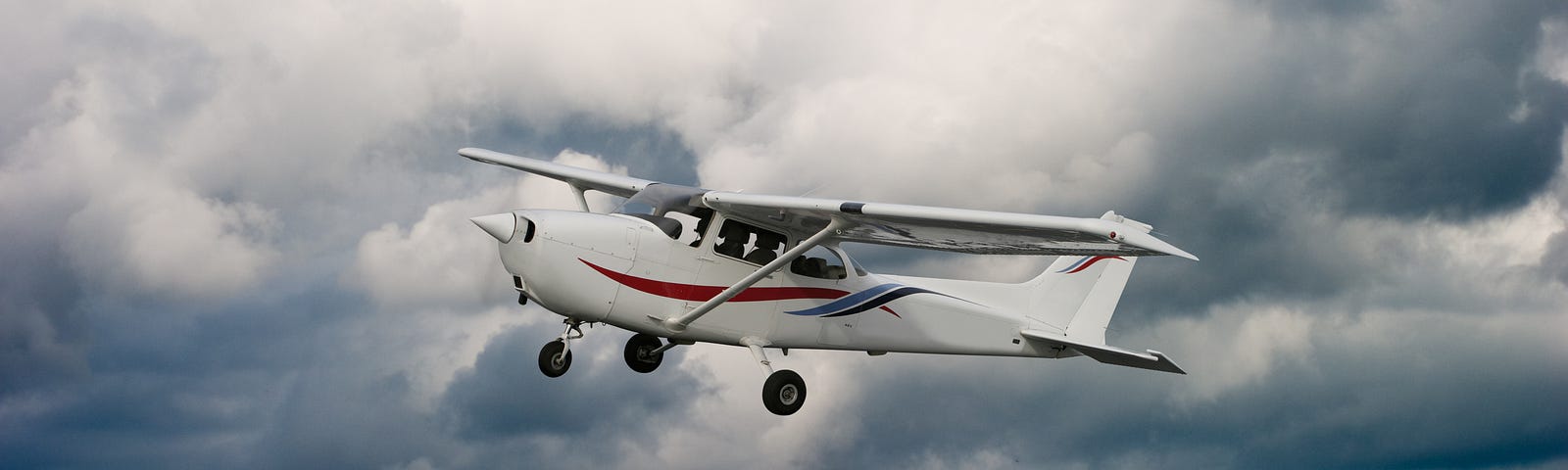 Stock image of a Cessna in flight.