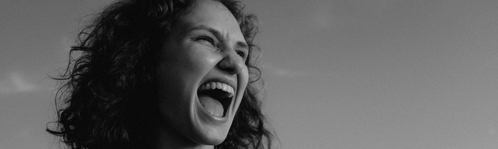 black and white photo of a woman shouting