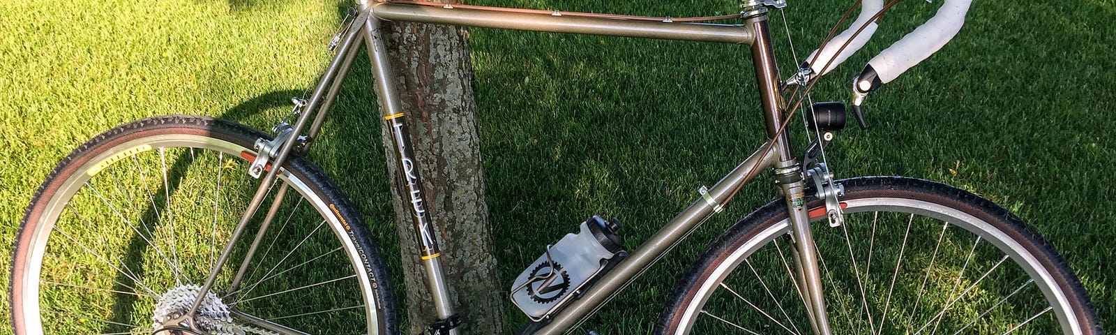 The author built this Trek 720 touring bike in 1982 while stationed with the US Air Force at Moody Air Force Base in Georgia. He rode it on his first bicycle tour of Minnesota in 1996. In 2014, he retrofitted the bike with new components, shown here, and rode it on a tour of Western Europe in 2014. Sadly, its frame broke on that tour. It rests in a landfill near Versailles, France.