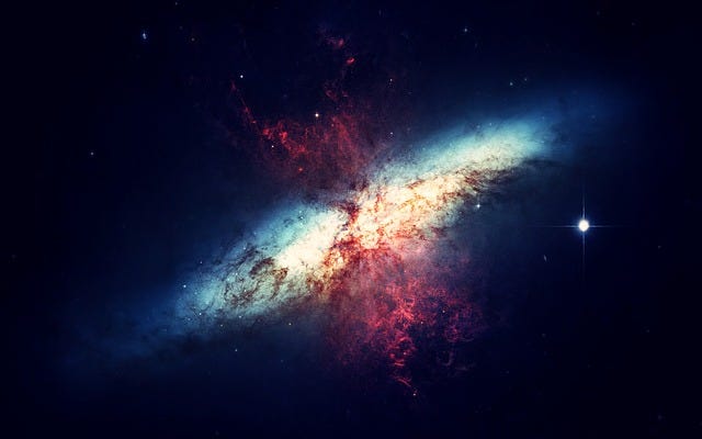 A picture of a galaxy with red jets of plasma at each pole