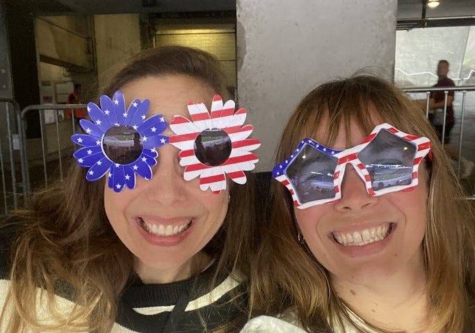 The author and her daughter are wearing decorative USA sunglasses.