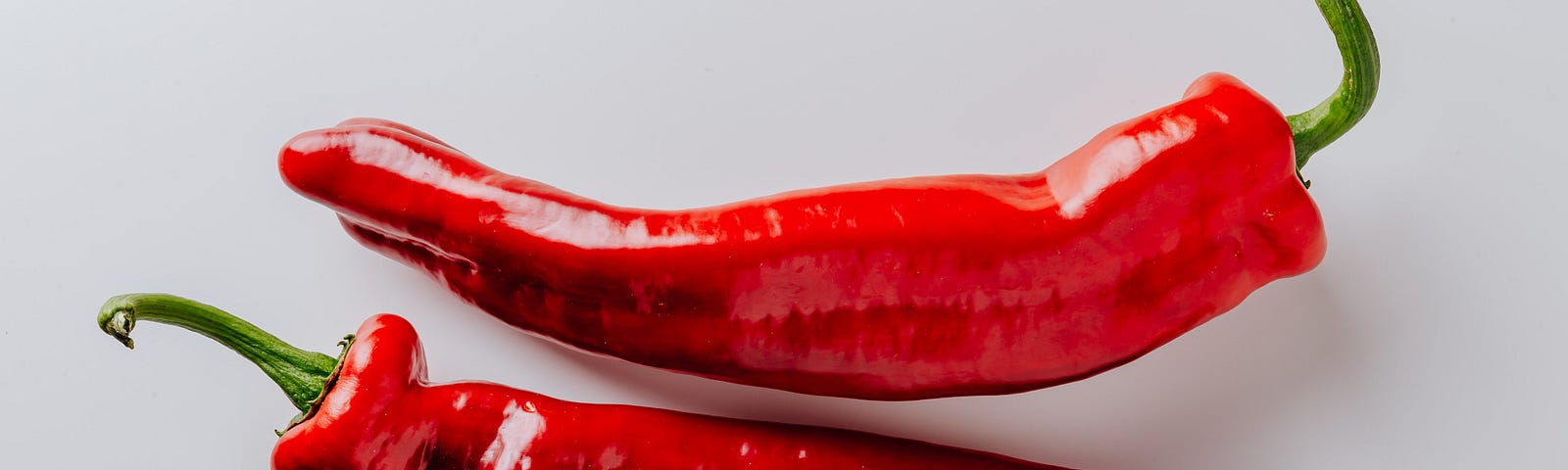 Red chillis on white background