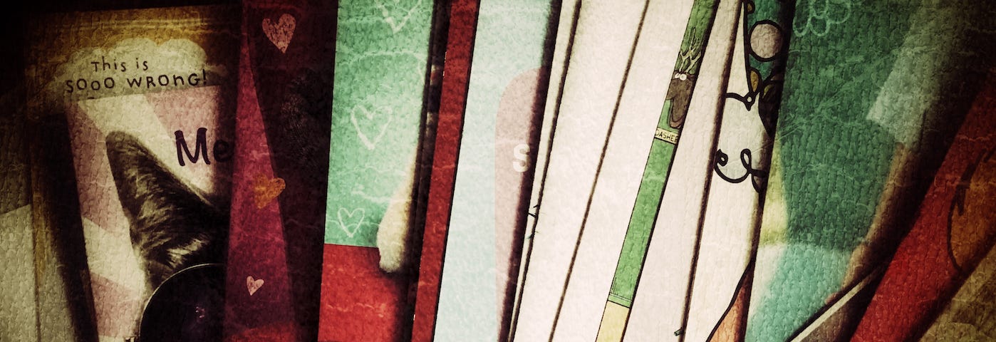 Photo of greeting cards on a table with a vintage filter applied.