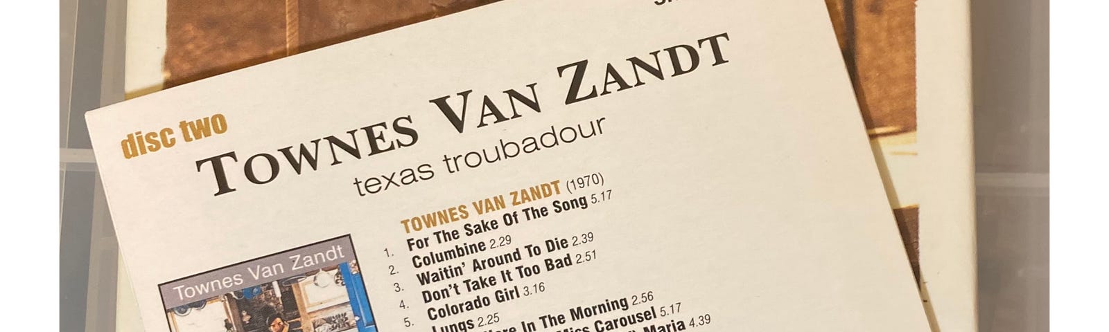 Author’s photo of their copy of the CD boxset Townes Van Zandt Texas Troubadour and the sleeve for disc two in that box