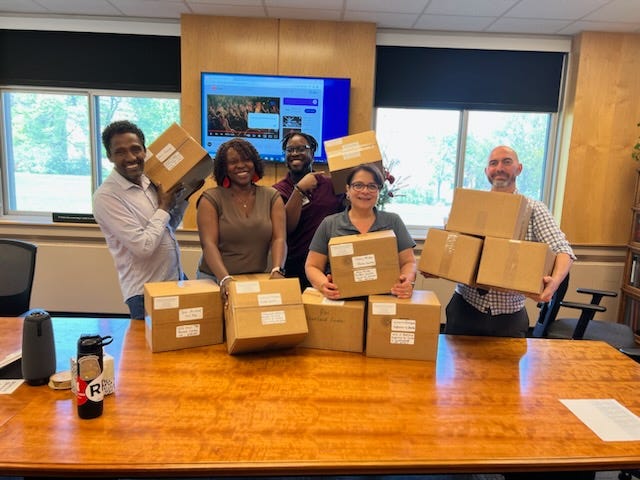 The Rural Fellows team holds boxes
