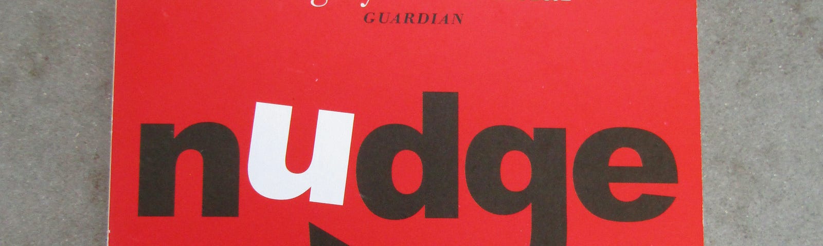 A battered red copy of Nudge by Richard H. Thaler and Bass R. Sunstein