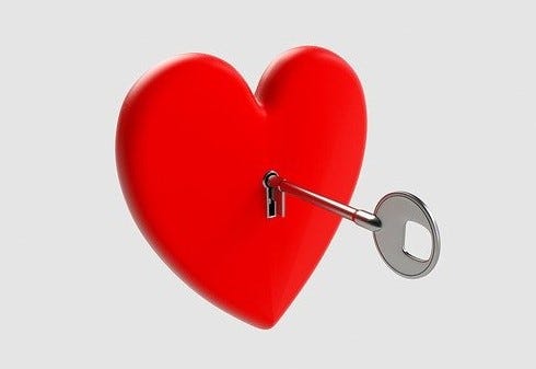 A drawing of a red heart with a key hole holding the key in the middle.