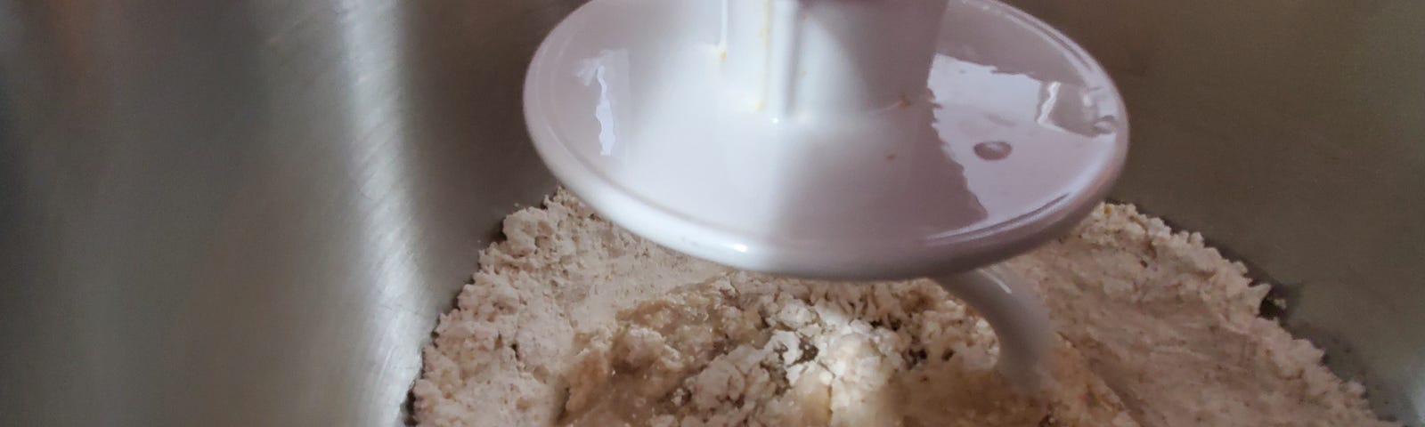 gluten free dough in a stand mixer with a bread hook