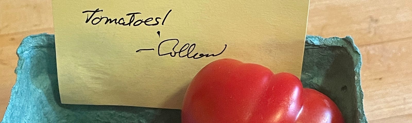 container of tomatoes with note “Enjoy. We have an abundance of tomatoes — Colleen”