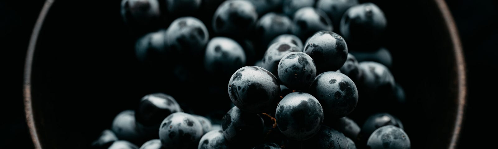 black grapes in a bowl