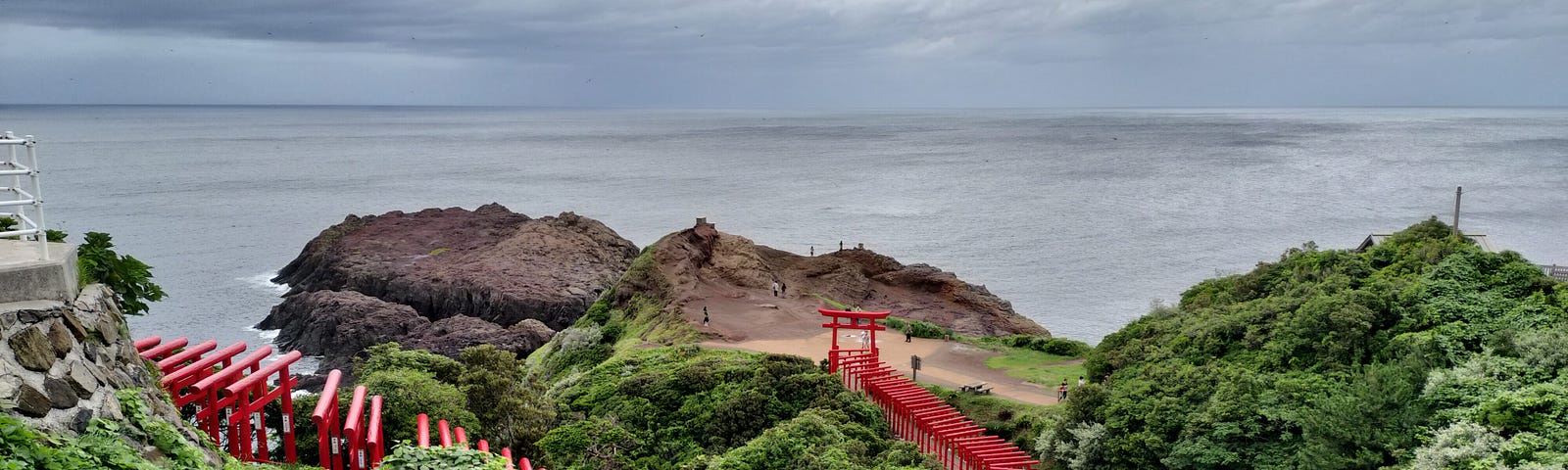 Motonosumi Inari Shrine — a picture of a row of torii gates located by the coast in Northern Yamaguchi prefecture.