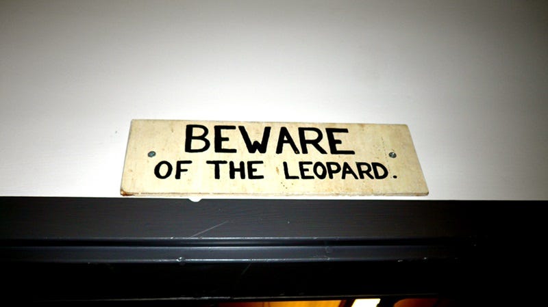 Beware of the Leopard sign above a door in the Imperial College Science Fiction Society, London, UK.