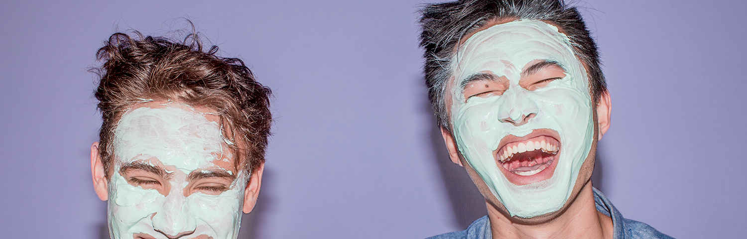 Two people using face masks for acne-prone skin