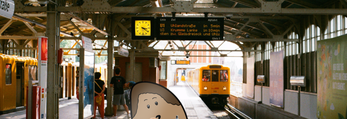 A blob wearing her orange attire standing at Warschauer Strasse subway station. The blob is eating a pretzel in one hand and a beer in the other. In the background an approaching yellow subway cart. The time reads 3:20 PM. On the left in the background are a few travelers wearing shorts, so it must be summer. The weather is sunny.