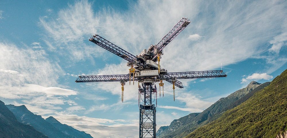 Photo of energy storage crane with Alps in background