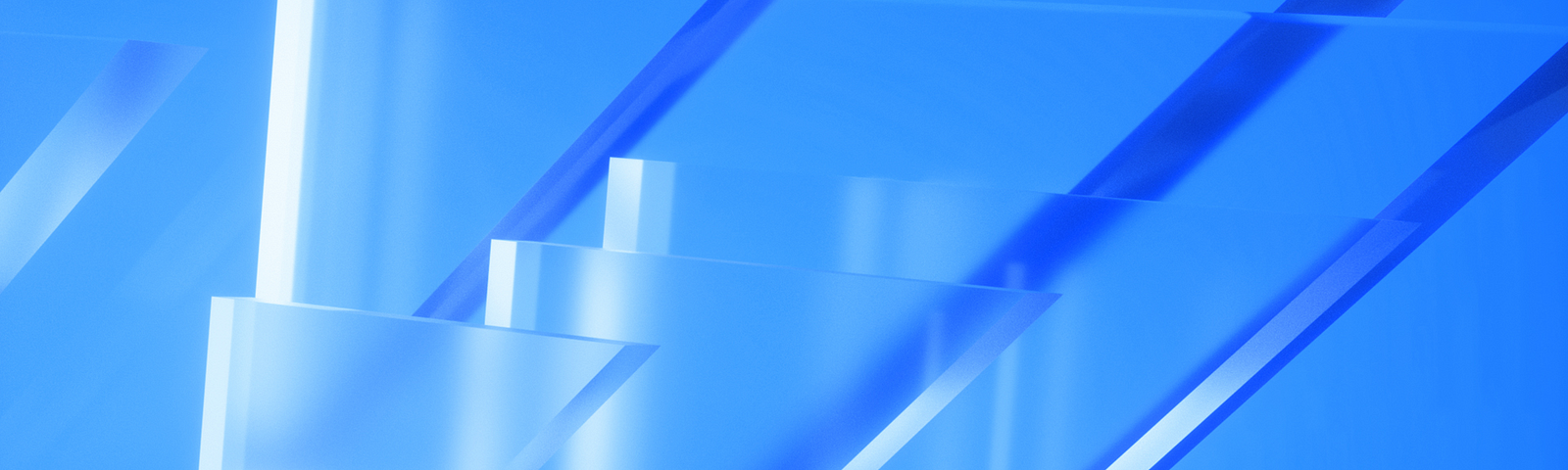 Abstract composition of translucent blue geometric shapes. Various rectangles and parallelograms overlap and intersect, casting subtle shadows and creating a sense of depth. The shapes are set against a gradient blue background that gives the image a cool, glass-like aesthetic.
