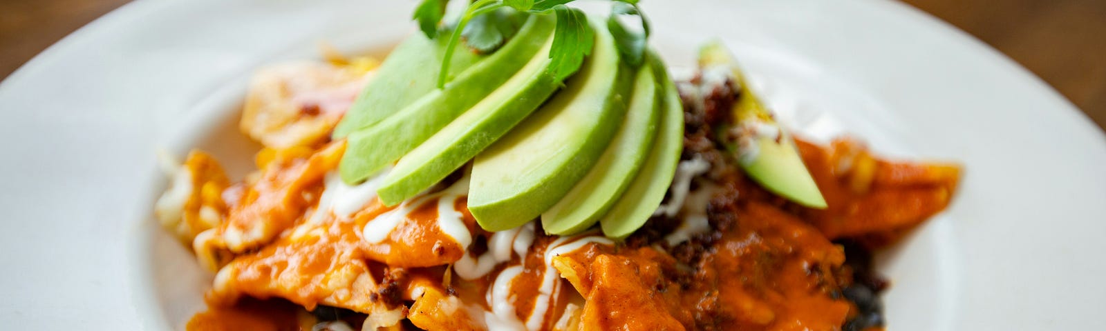 Chilaquiles with avocado.