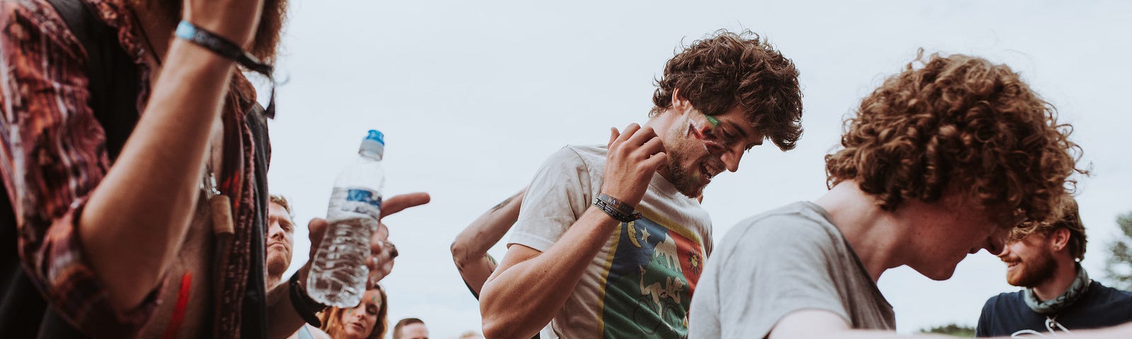 Hippies dance and listen to music at a festival